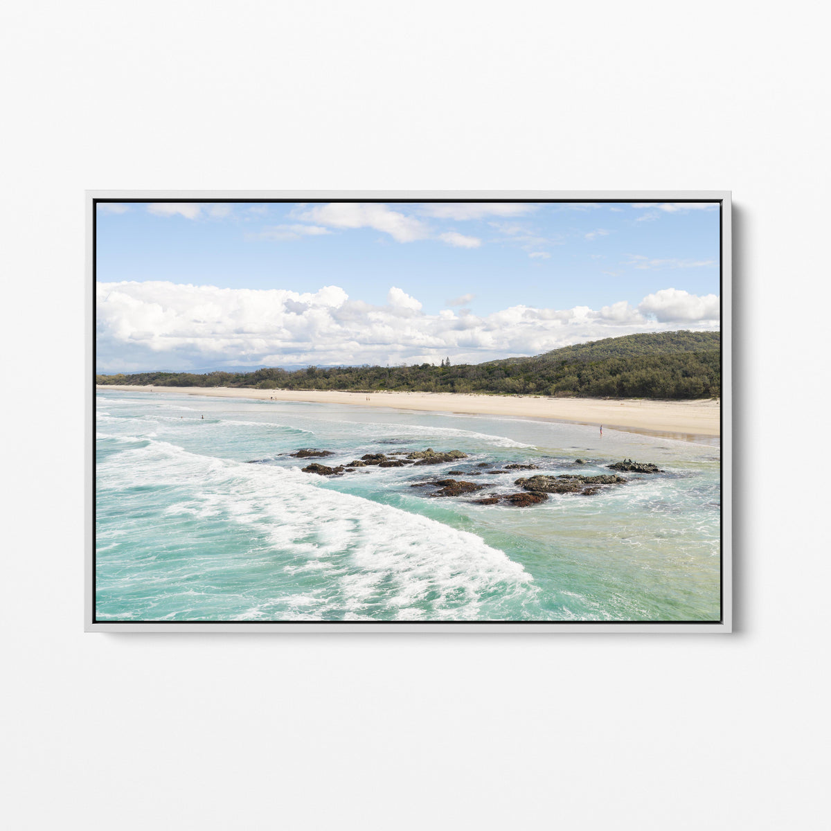 Aerial photograph of the reef shelf and beach at Hastings Point NSW in a white frame