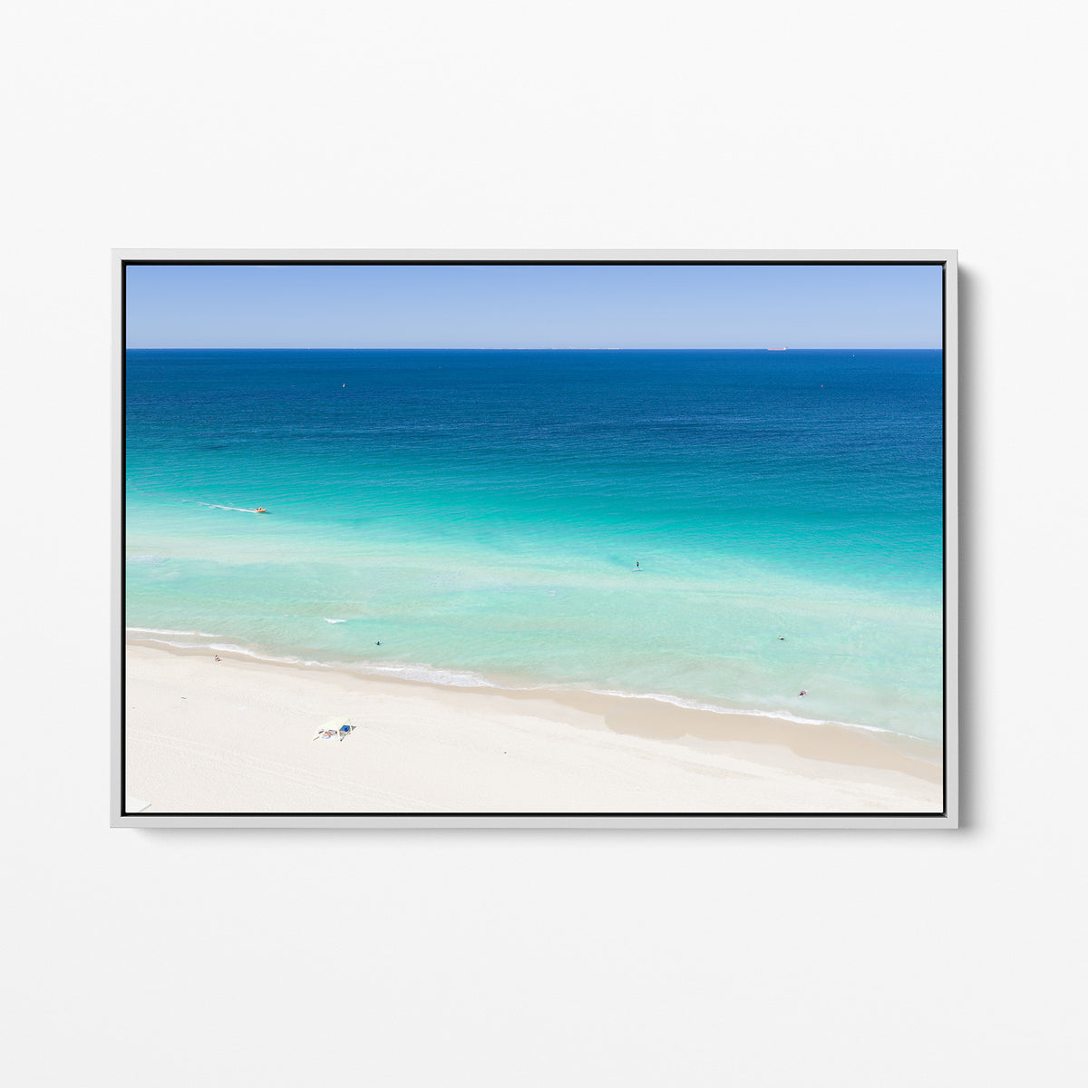 White framed canvas print of aerial photography of Scarborough Beach, deep blue water, turquoise shallows and an almost empty white sand beach