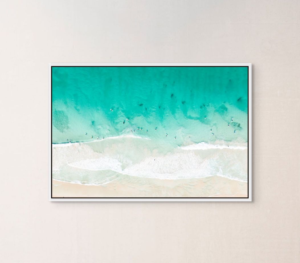 Ocean waves print hanging in a home