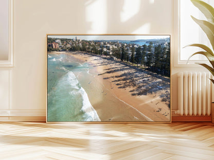 Aerial photograph of a surfer at Manly Beach, Sydney hanging on a wall