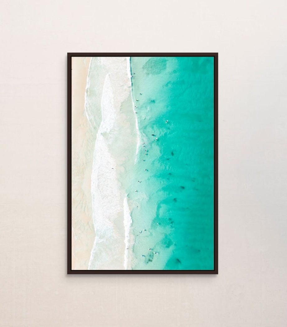 Ocean waves print hanging in a home