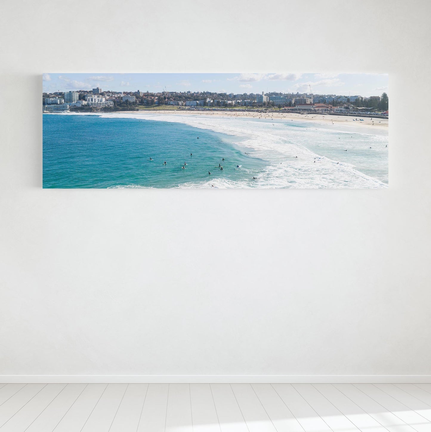 Bondi Beach surfers panoramic canvas hanging in a room