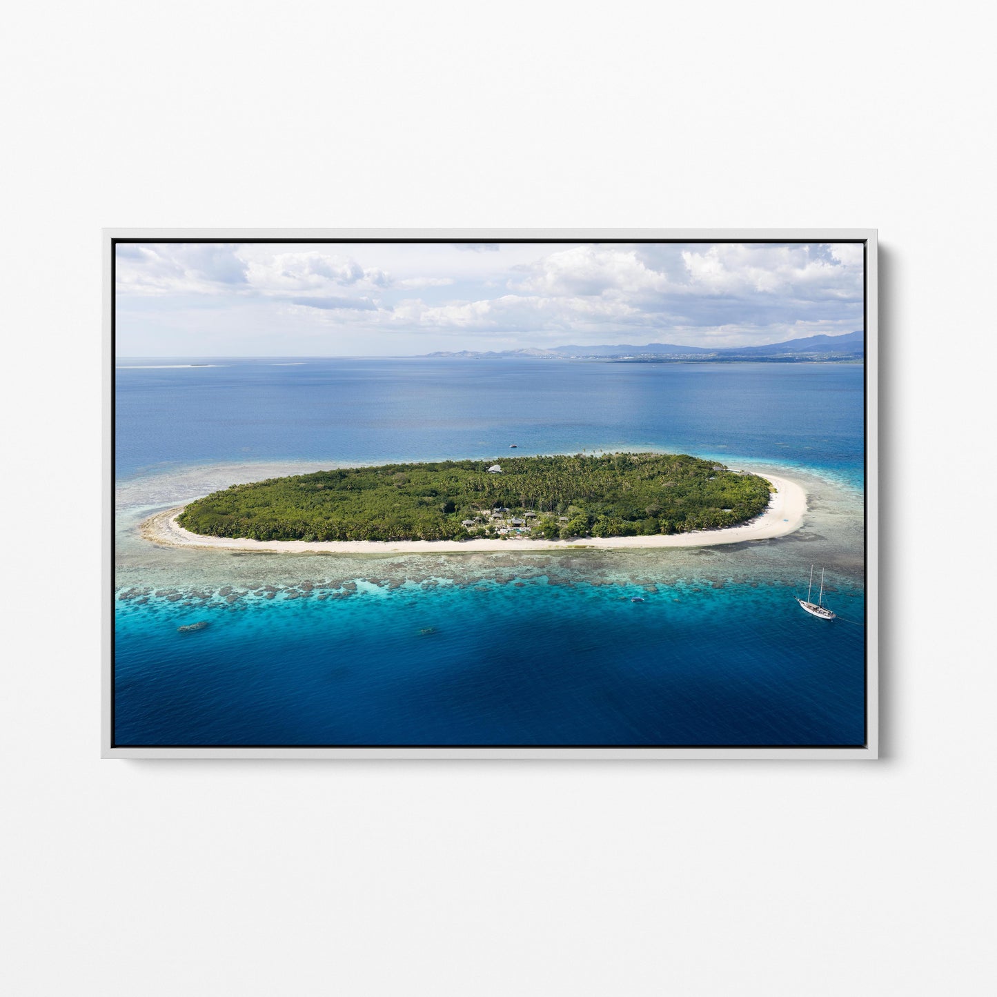The whole of Serenity Island in Fiji from the air, in a white frame