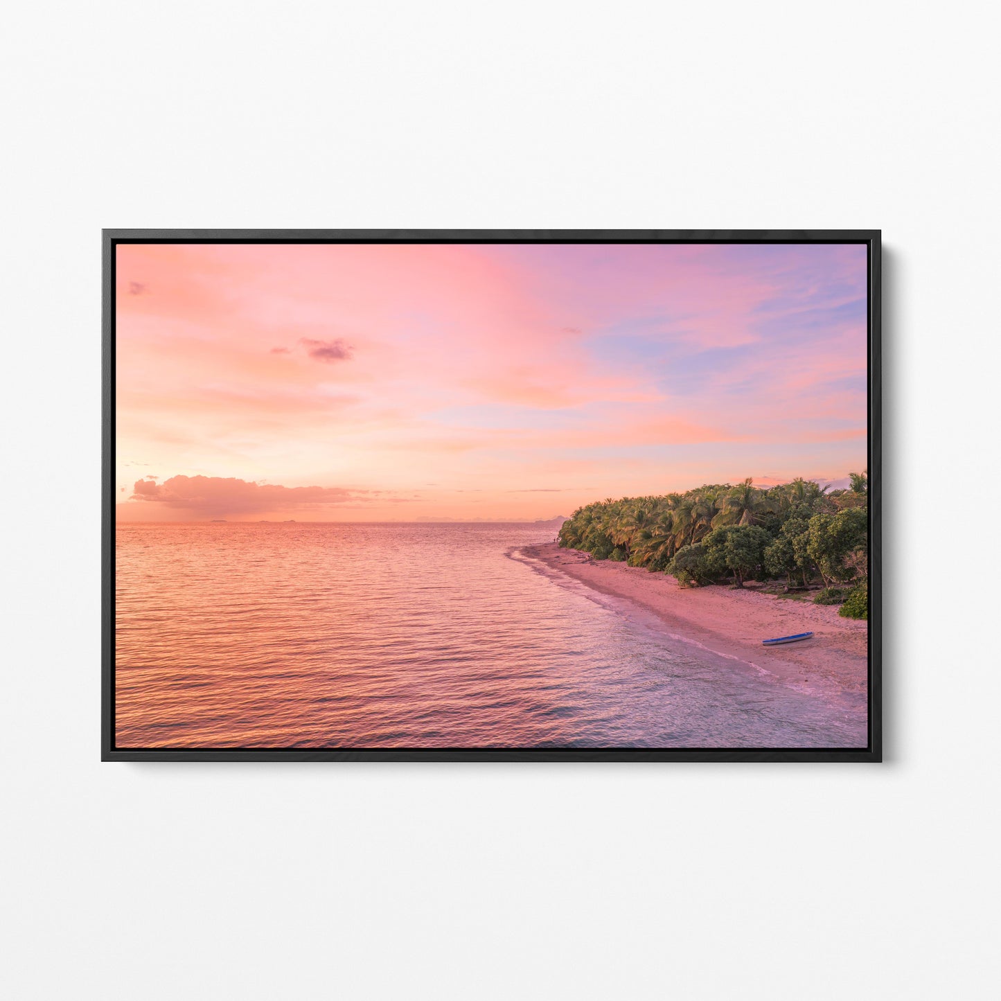 Serenity Island at sunset in Fiji in a black frame