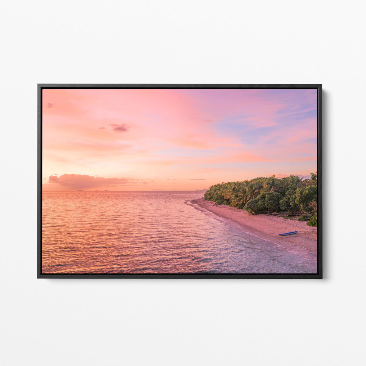 Serenity Island at sunset in Fiji in a black frame