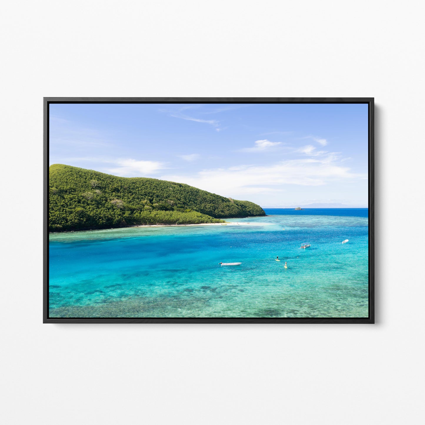 Manta Ray Island above its turquoise lagoon in Fiji in a black frame