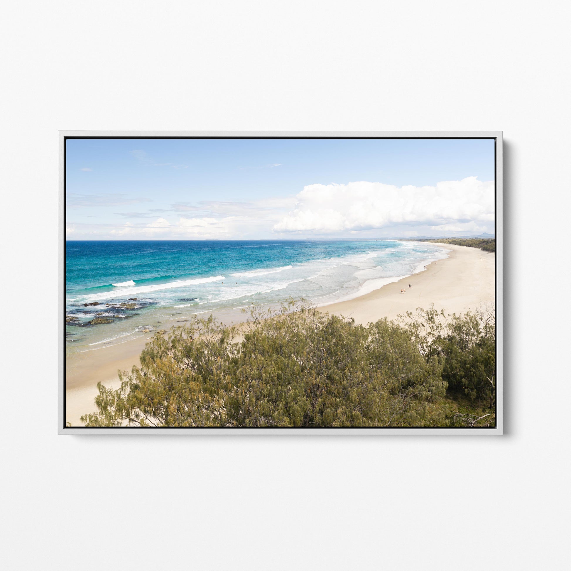 Aerial photograph of the Hastings Point coastline NSW past the dune scrub in a white frame