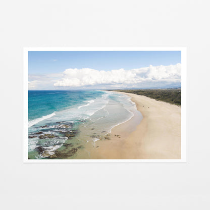 Aerial photograph of the wide beach and reef at Hastings Point NSW with the hinterland ranges behind, as a fine art paper print