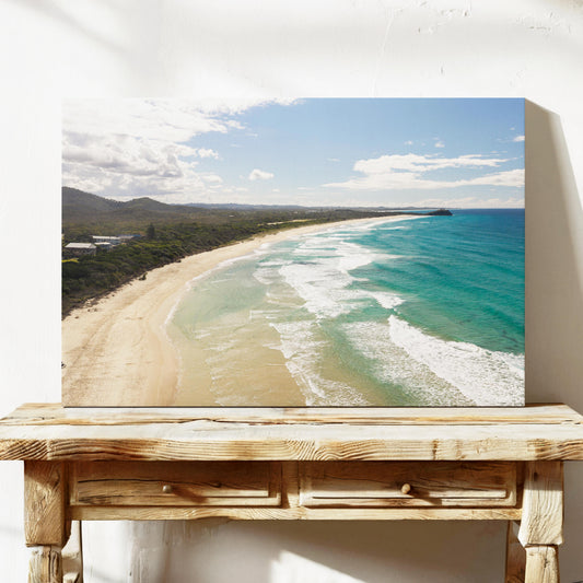 Aerial photograph of surf peeling along the length of Hastings Point beach NSW, printed on stretched canvas