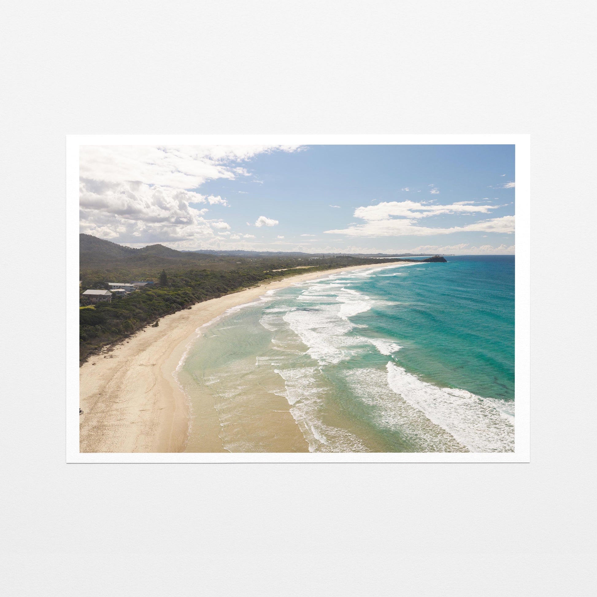 Aerial photograph of surf peeling along the length of Hastings Point beach NSW as a fine art paper print