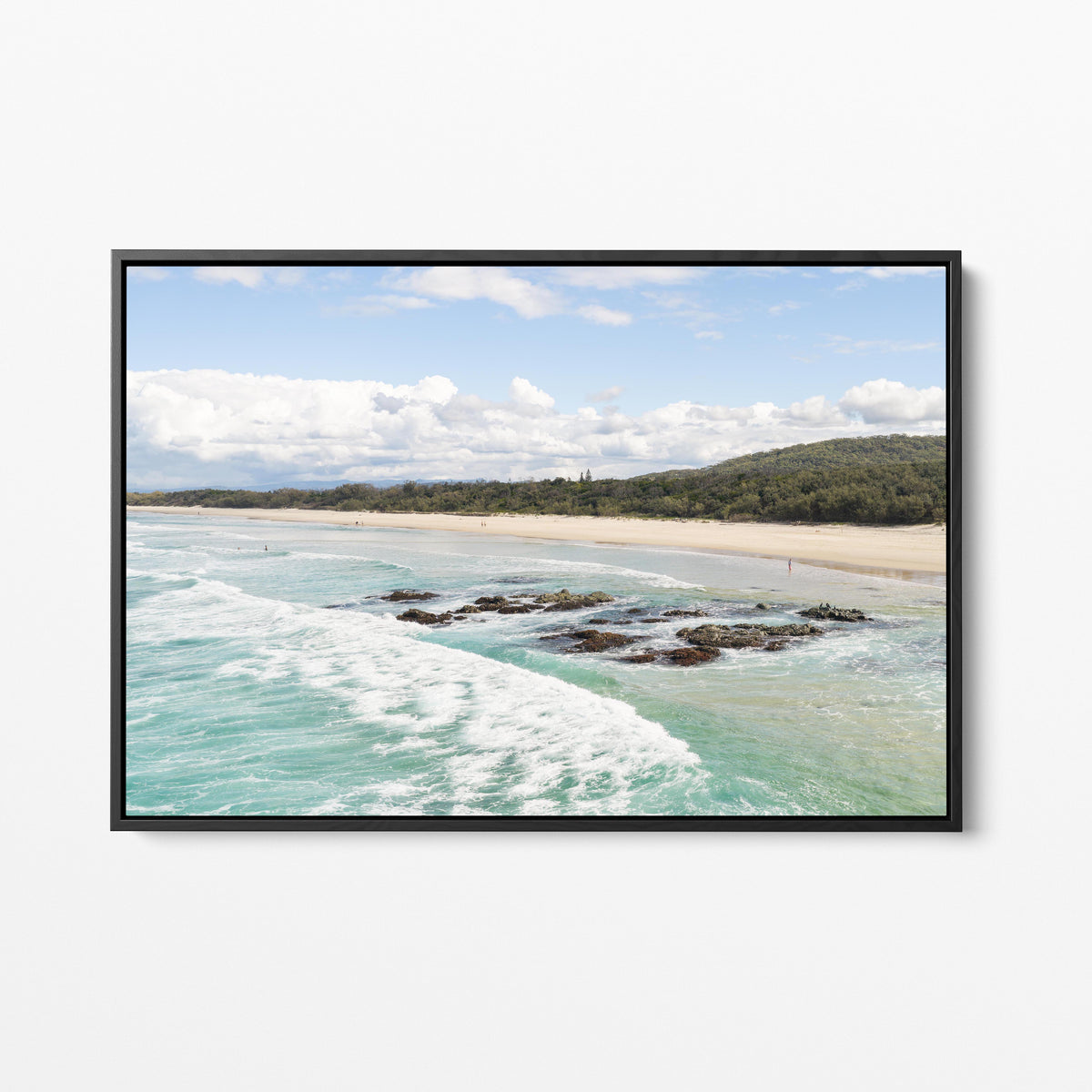Aerial photograph of the reef shelf and beach at Hastings Point NSW in a black frame