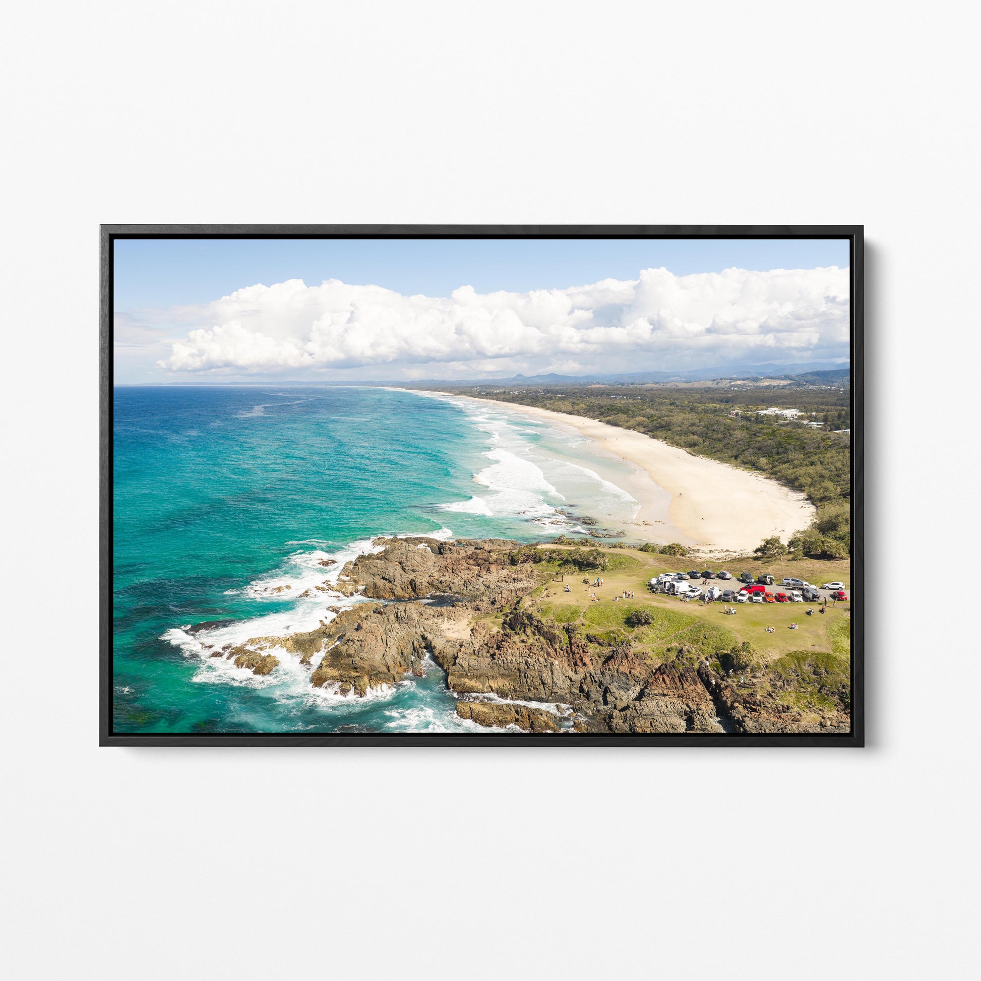 Aerial photograph of the green headland above the rocks at Hastings Point NSW in a black frame