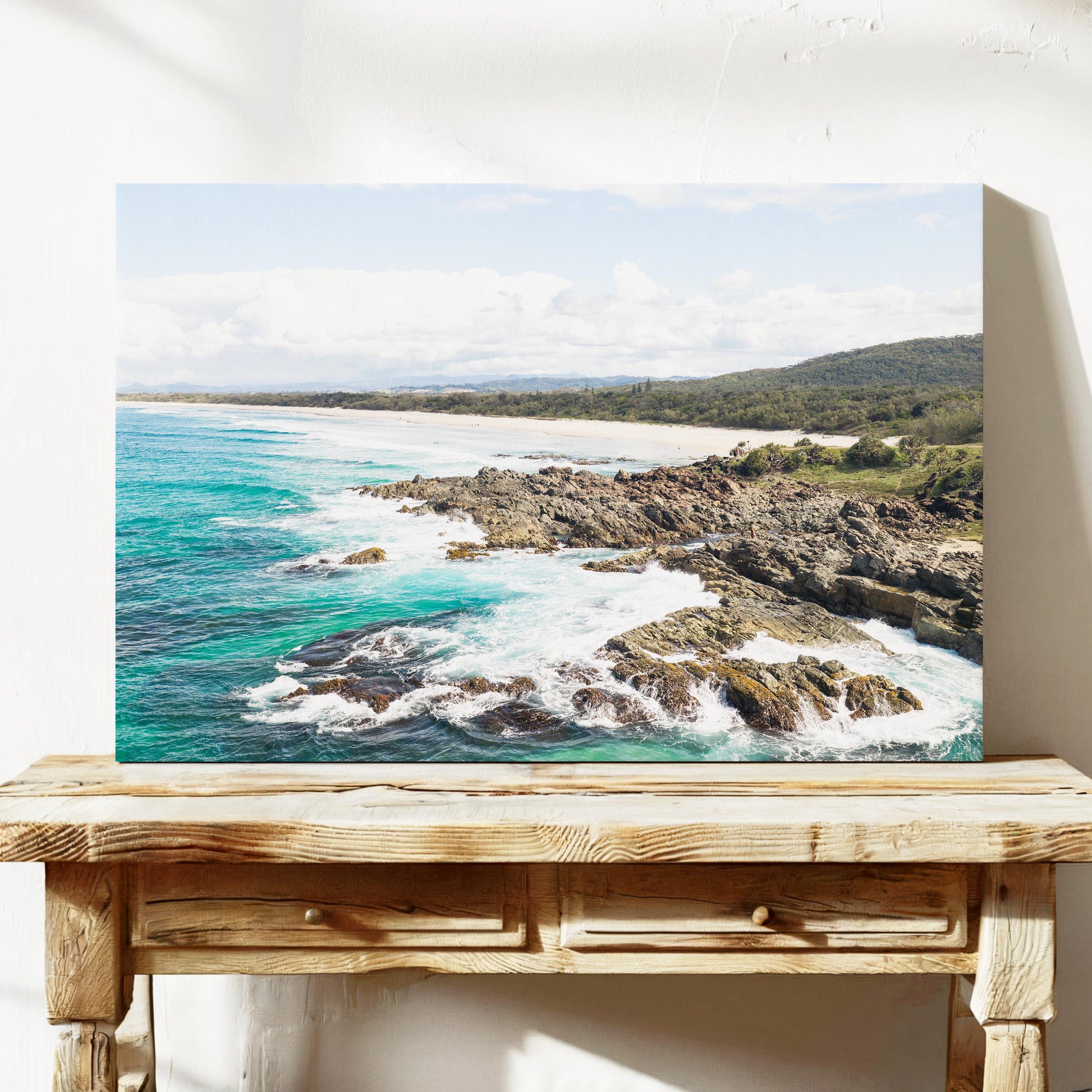 Aerial photograph of surf breaking over the headland rocks at Hastings Point NSW, printed on stretched canvas