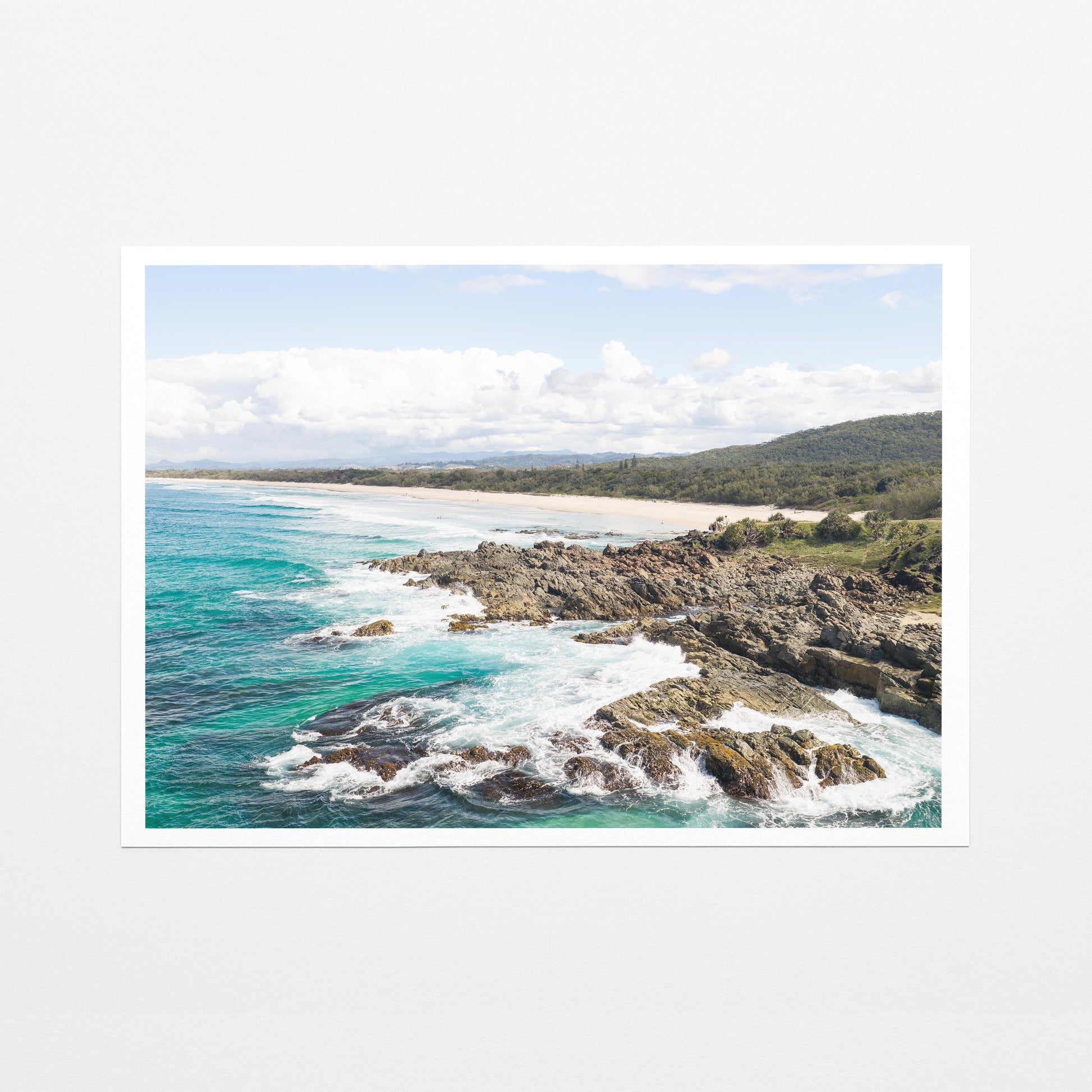 Aerial photograph of surf breaking over the headland rocks at Hastings Point NSW as a fine art paper print