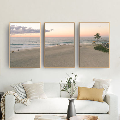 Rainbow Bay sunset three piece canvas wall art in living room