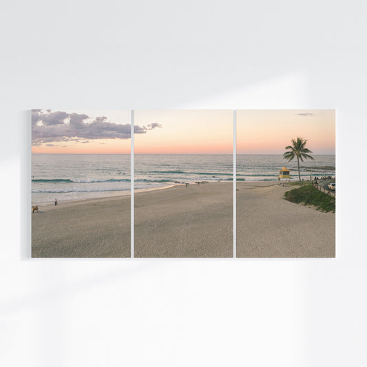 Rainbow Bay sunset three piece canvas wall art on wall