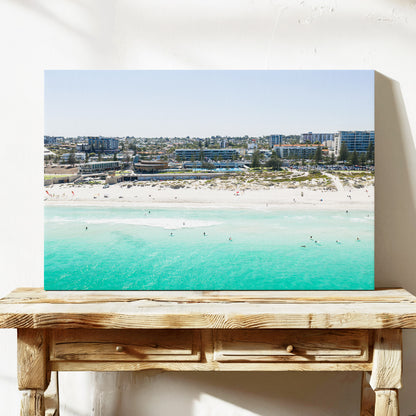Stretched canvas print of aerial photography of Scarborough Beach, buildings along the beachfront above turquoise shallows and white sand on a console table