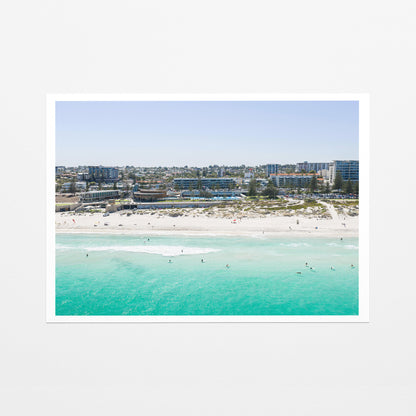 Fine art paper print of aerial photography of Scarborough Beach, buildings along the beachfront above turquoise shallows and white sand with a white border