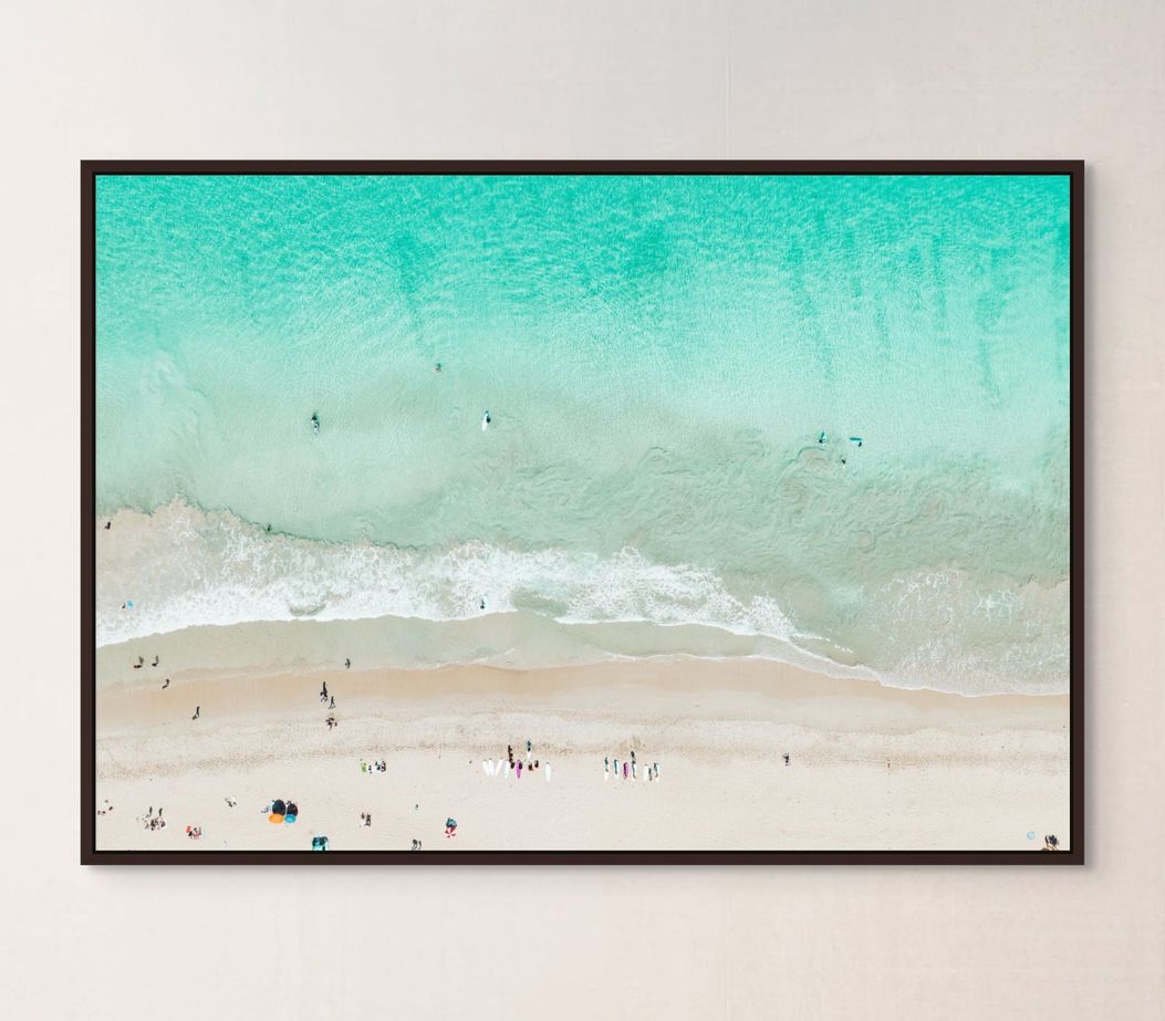 Scarborough Beach surfer canvas in a black frame