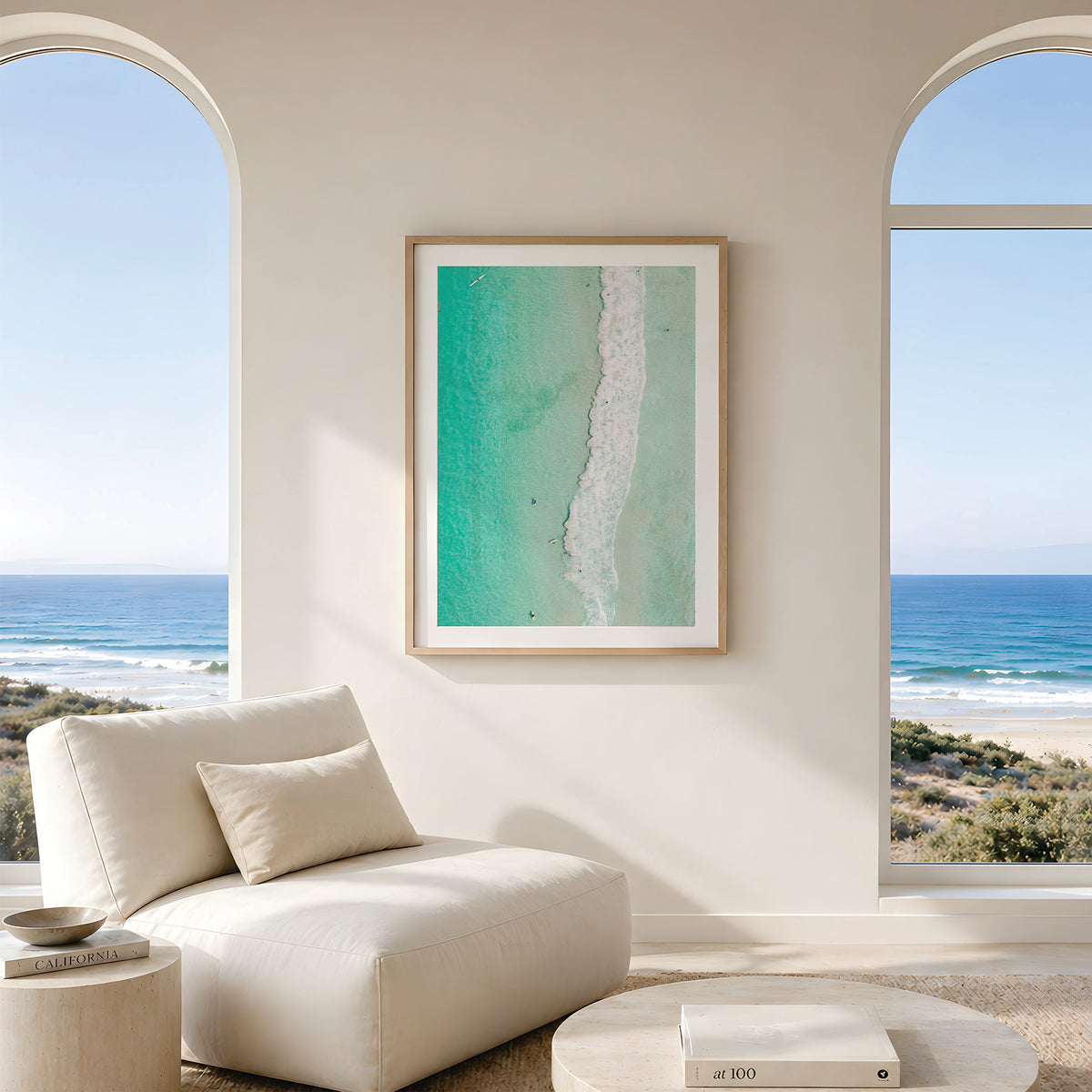 Framed canvas print of aerial photography of Scarborough Beach, a line of white wave across green turquoise shallows in portrait orientation hanging in a living room