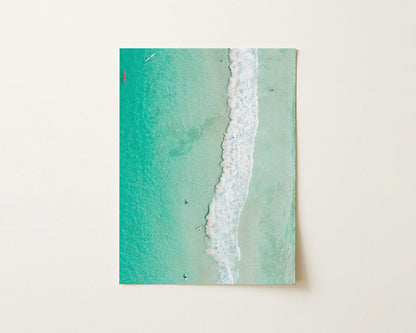 Fine art paper print of aerial photography of Scarborough Beach, a line of white wave across green turquoise shallows in portrait orientation