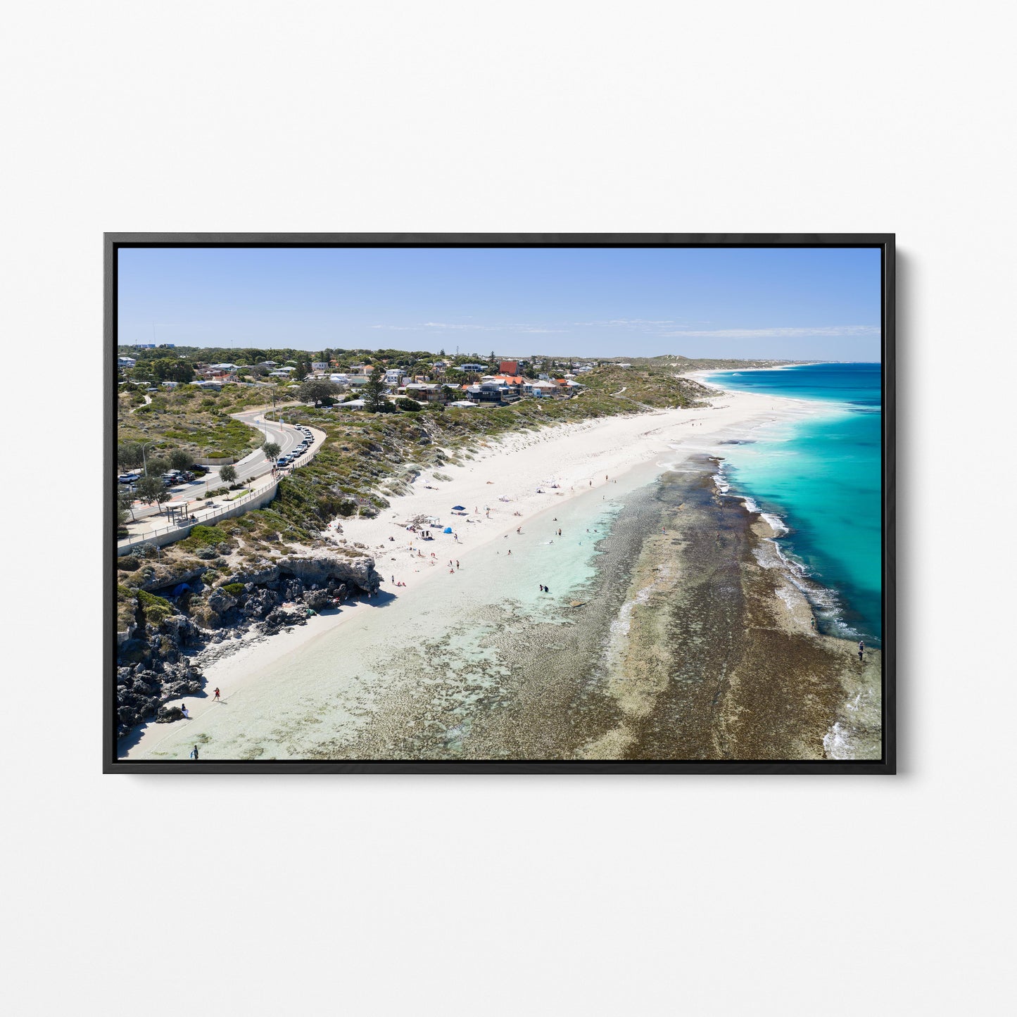 Yanchep Lagoon with the town above the beach, in a black frame