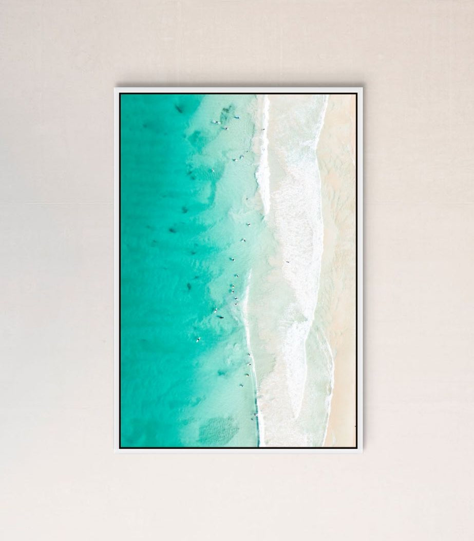 Ocean waves print hanging in a home
