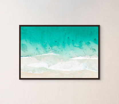 Ocean waves print hanging in a home