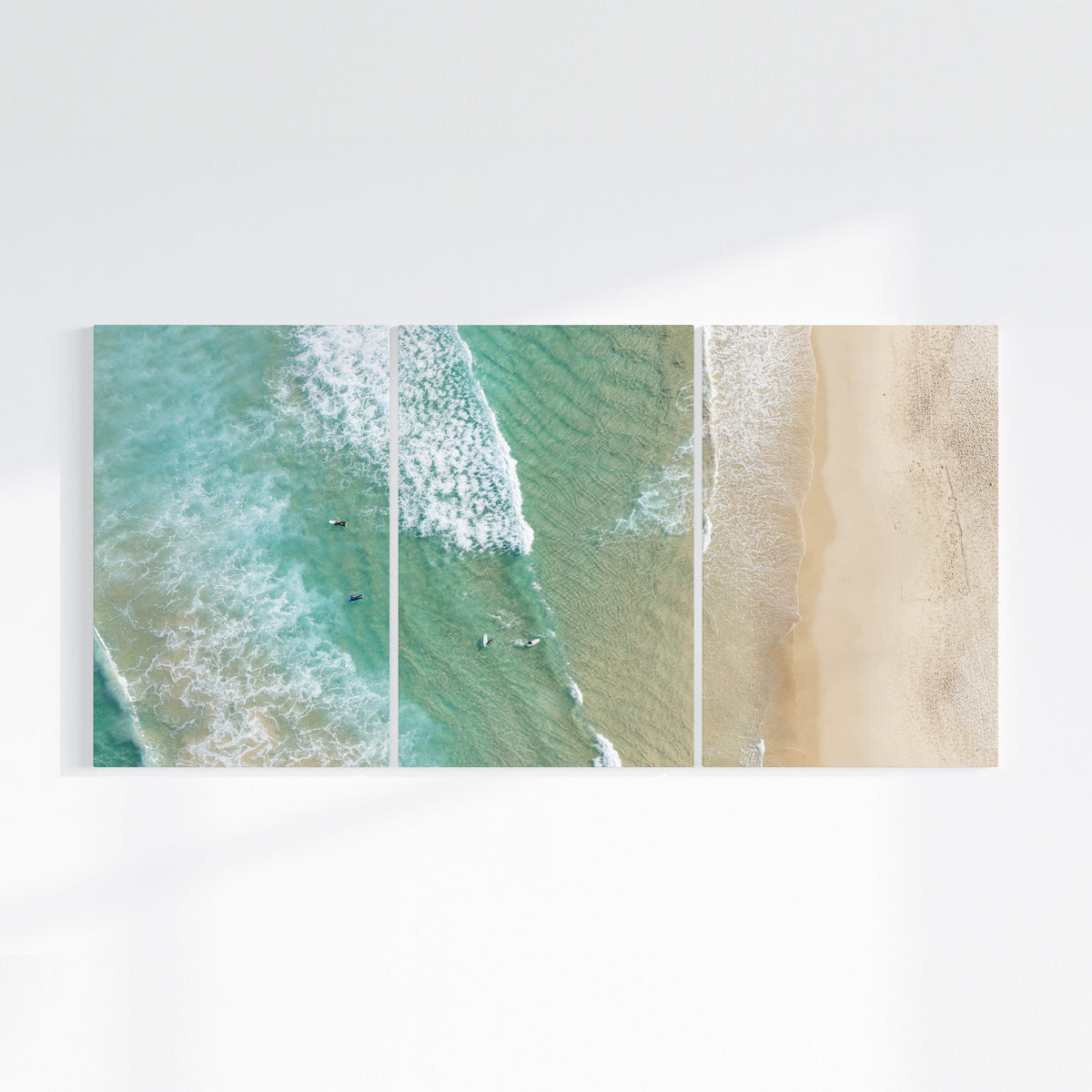 Bondi Beach birdseye three piece canvas wall art on wall