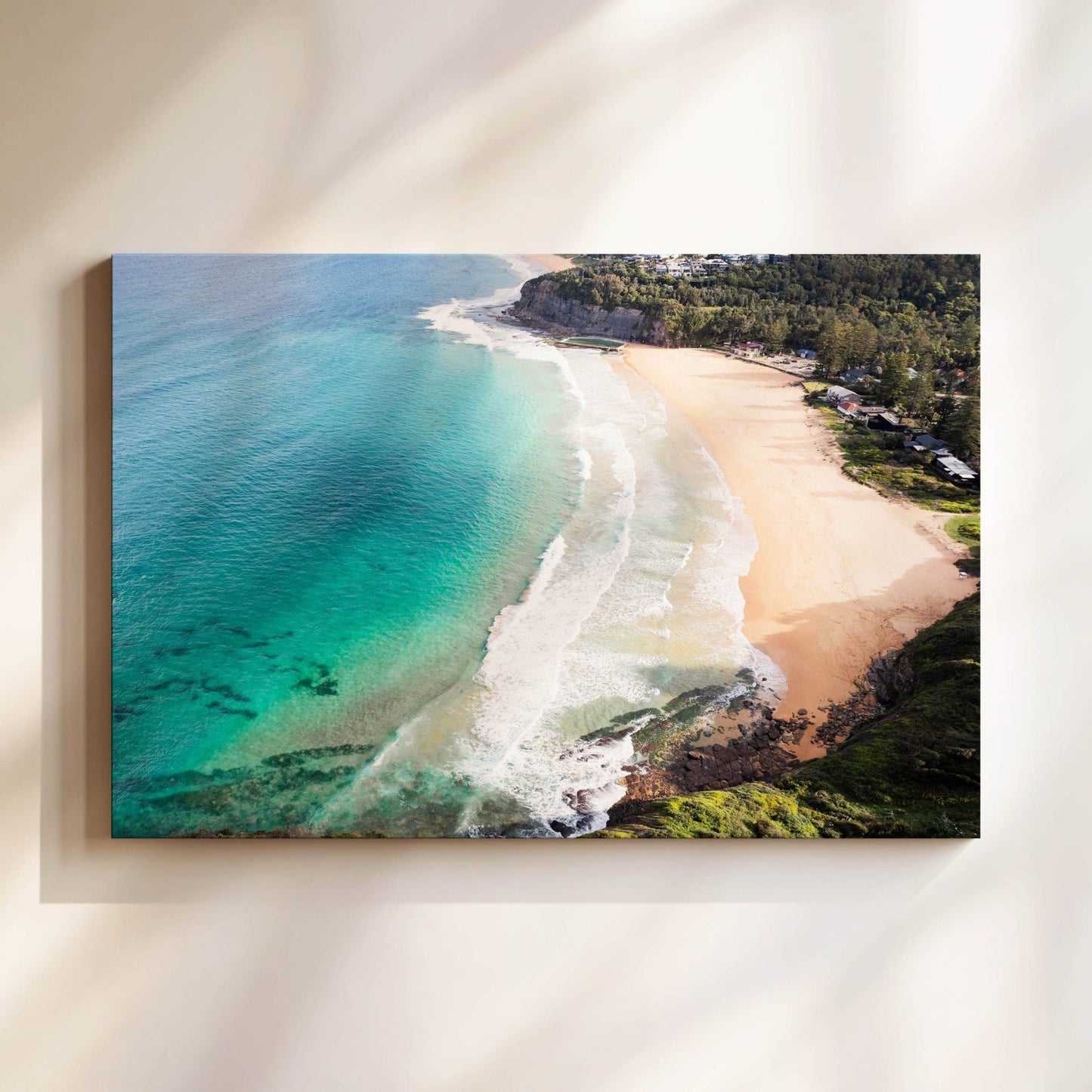 Aerial photograph of Bilgola Beach Sydney hanging on a wall