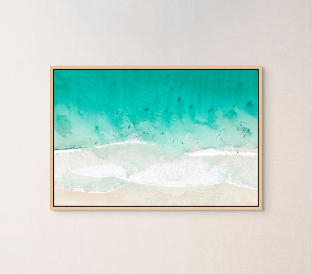 Ocean waves print hanging in a home