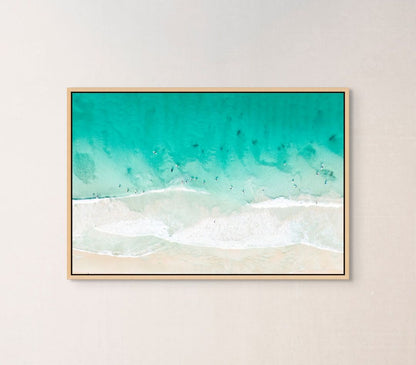 Ocean waves print hanging in a home