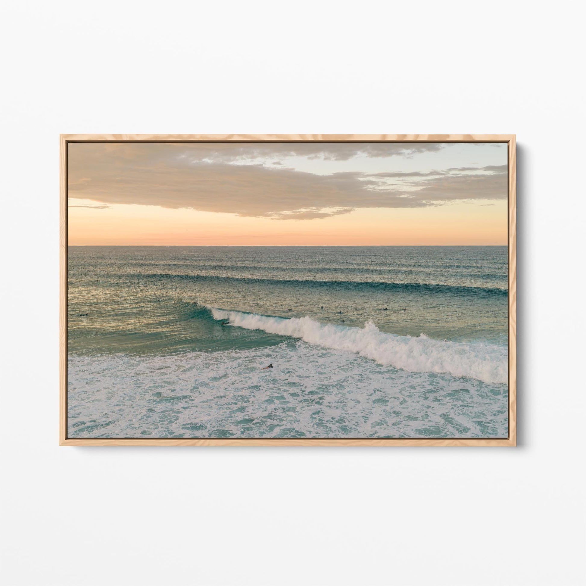 Oak framed canvas print of a breaking wave at Duranbah Beach at sunset, New South Wales