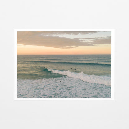 Fine art paper print of a breaking wave at Duranbah Beach at sunset, with a white border