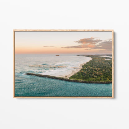 Oak framed canvas print of the headland and curving beach at Duranbah at sunset, New South Wales