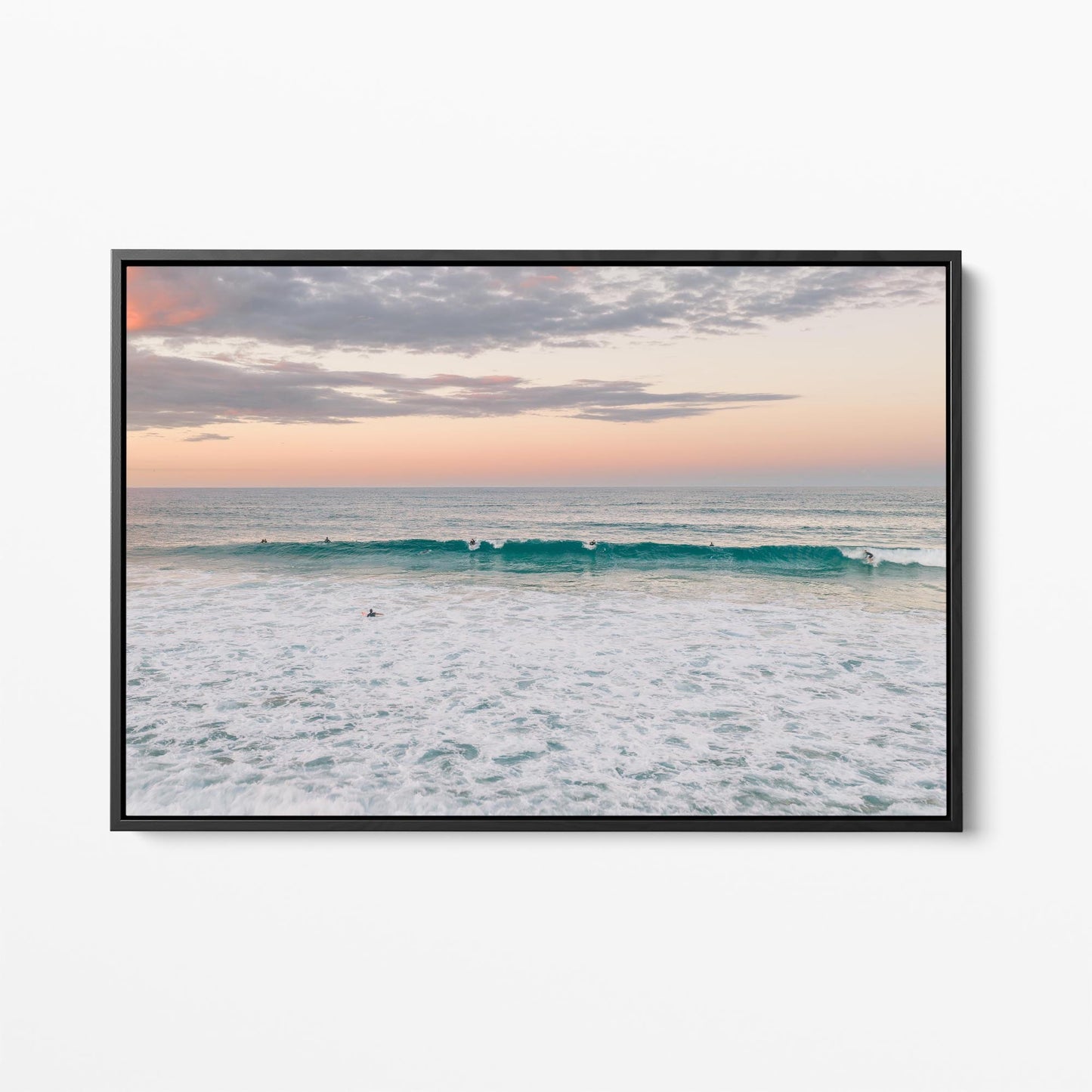 Black framed canvas print of a lone surfer at Duranbah Beach at sunset, New South Wales