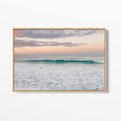 Oak framed canvas print of a lone surfer at Duranbah Beach at sunset, New South Wales