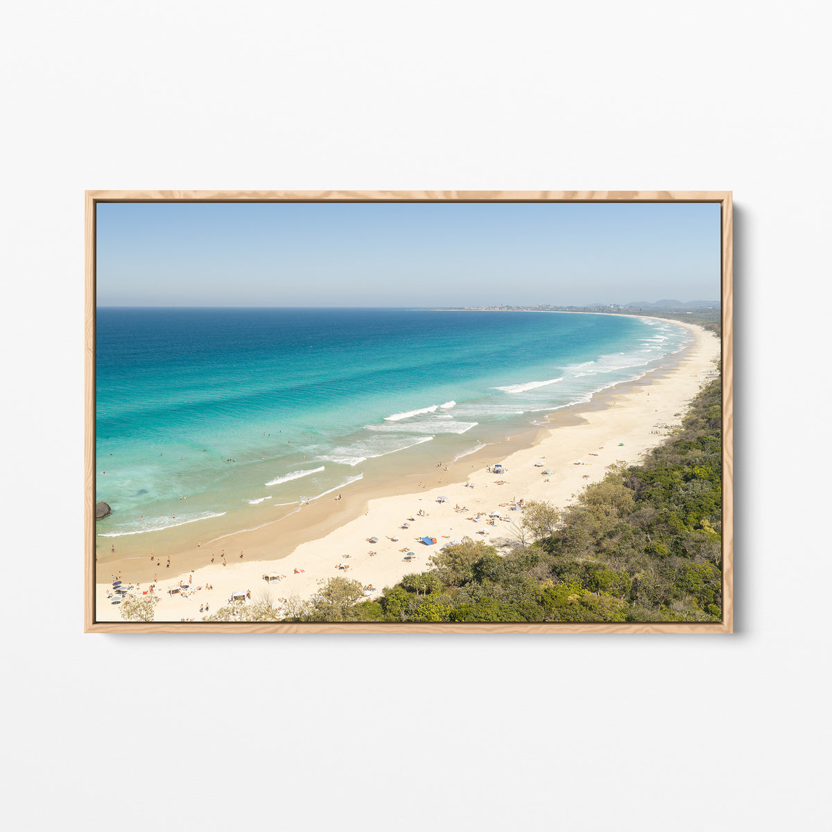 Oak framed canvas print of aerial photography of Dreamtime Beach, a long curving beach with turquoise water and coastal bush