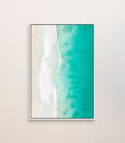 Ocean waves print hanging in a home