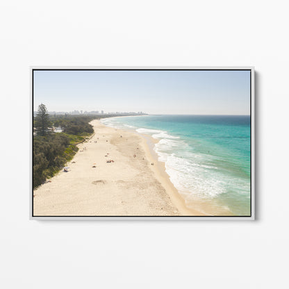 White framed canvas print of aerial photography of Fingal Head, a long sandy beach with bush on the left and surf rolling onto the shore