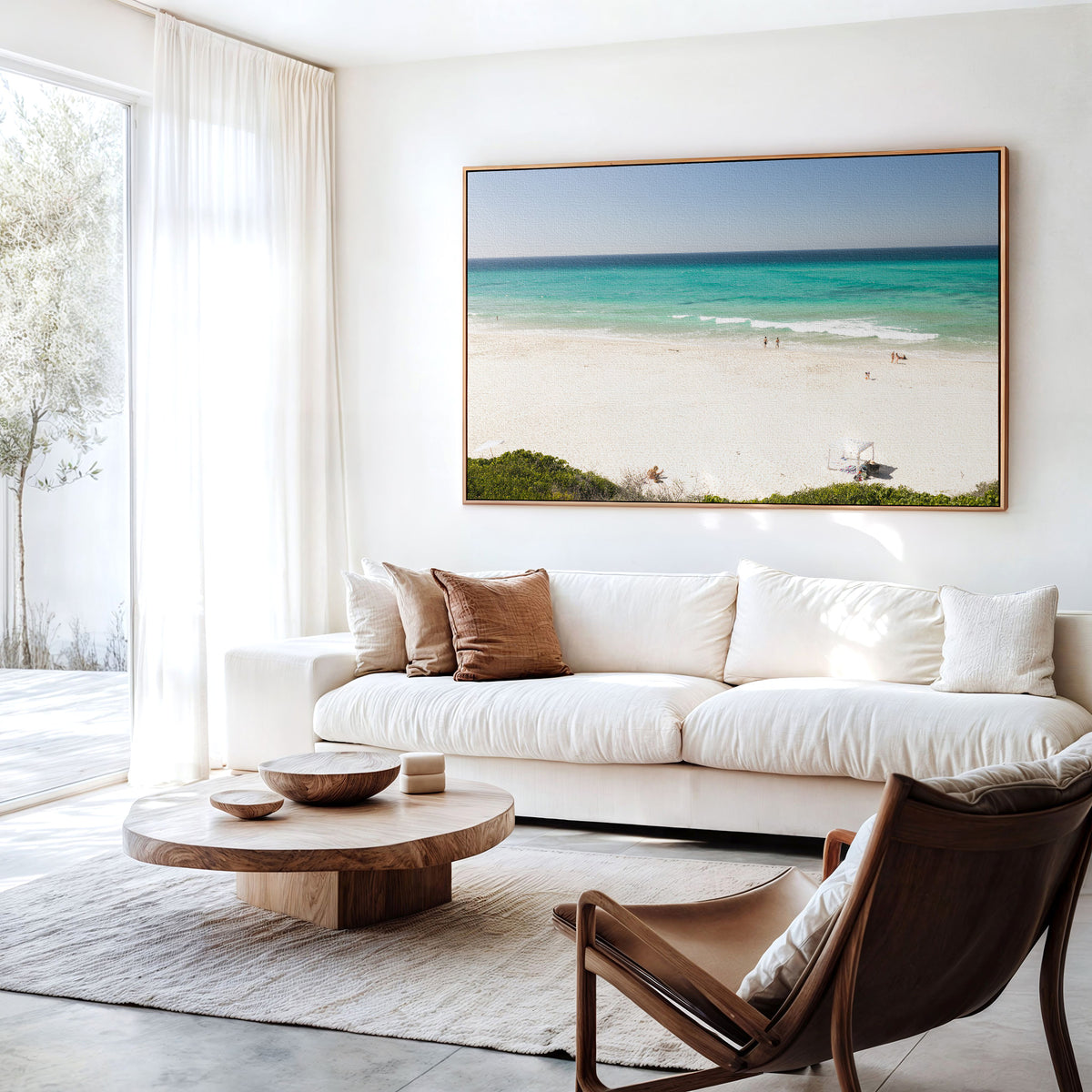 Canvas print of aerial photography of Fingal Head, white sand and turquoise water with a small structure and bush at the bottom hanging above a sofa in a living room