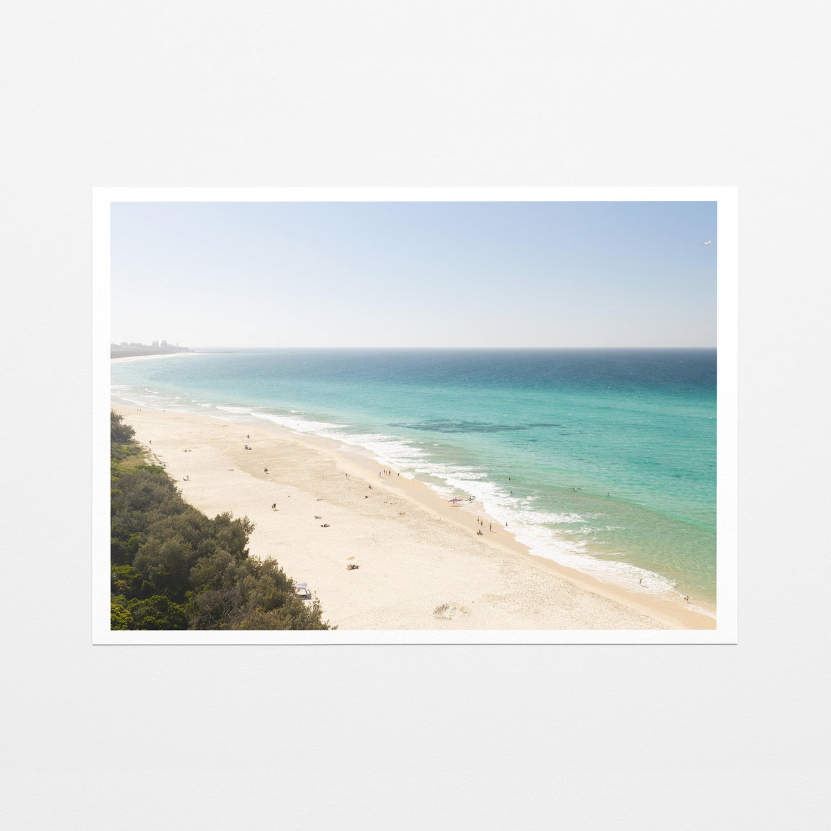 Fine art paper print of aerial photography of Fingal Head, a pale sand beach with coastal bush in the bottom left and turquoise water with a white border