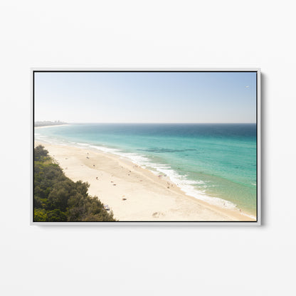 White framed canvas print of aerial photography of Fingal Head, a pale sand beach with coastal bush in the bottom left and turquoise water
