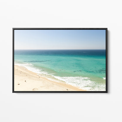 Black framed canvas print of aerial photography of Fingal Head, a long strip of sand with turquoise surf rolling onto the shore