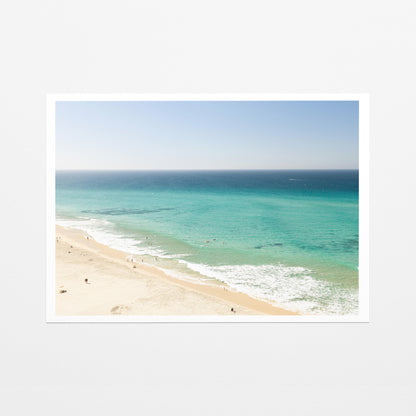 Fine art paper print of aerial photography of Fingal Head, a long strip of sand with turquoise surf rolling onto the shore with a white border