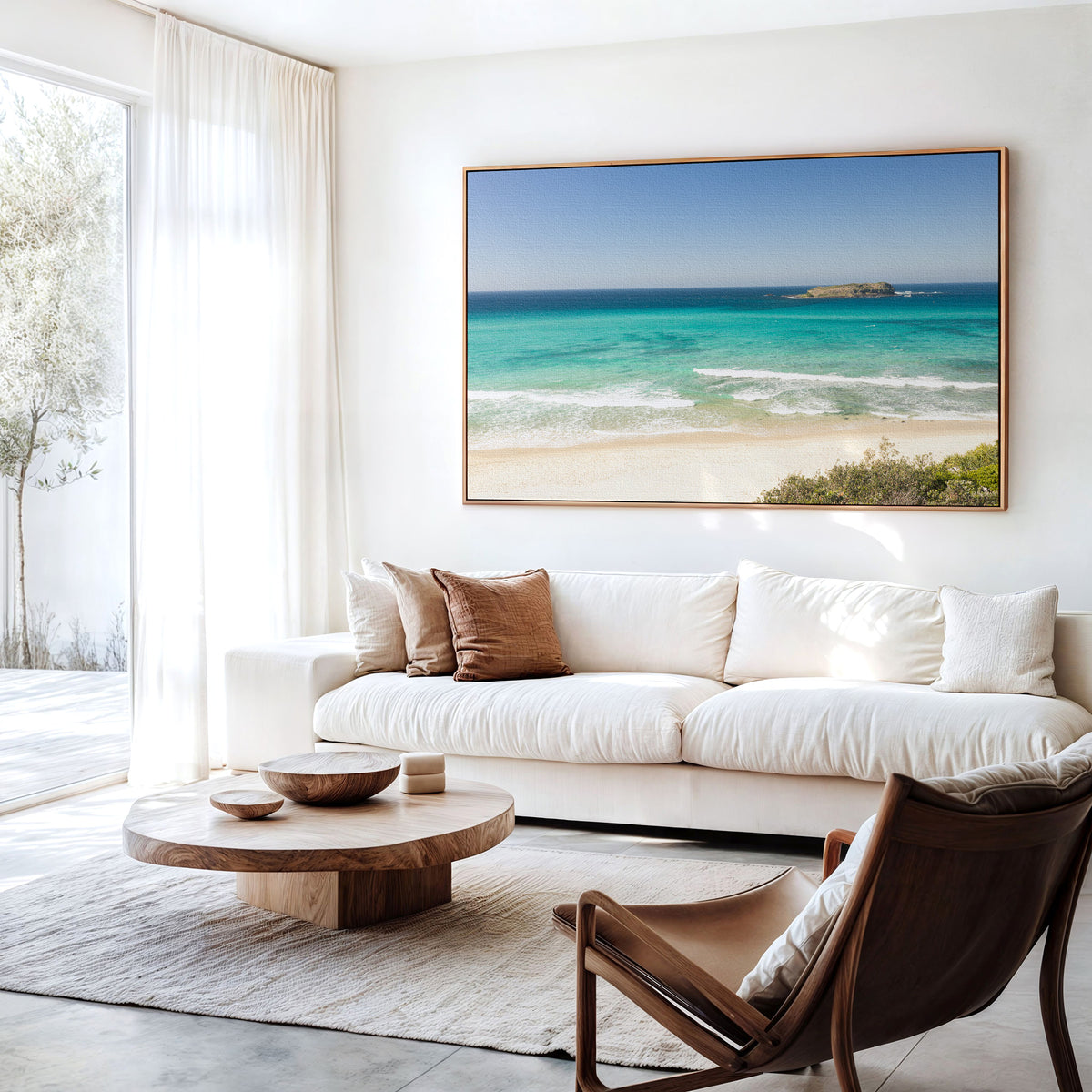 Canvas print of aerial photography of Fingal Head, a beach with a small island offshore and turquoise water hanging above a sofa in a living room