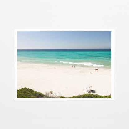 Fine art paper print of aerial photography of Fingal Head, white sand and turquoise water with a small structure and bush at the bottom with a white border