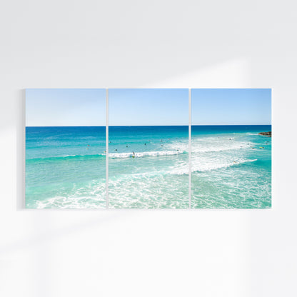 Palm Beach Surfers three piece canvas wall art on wall