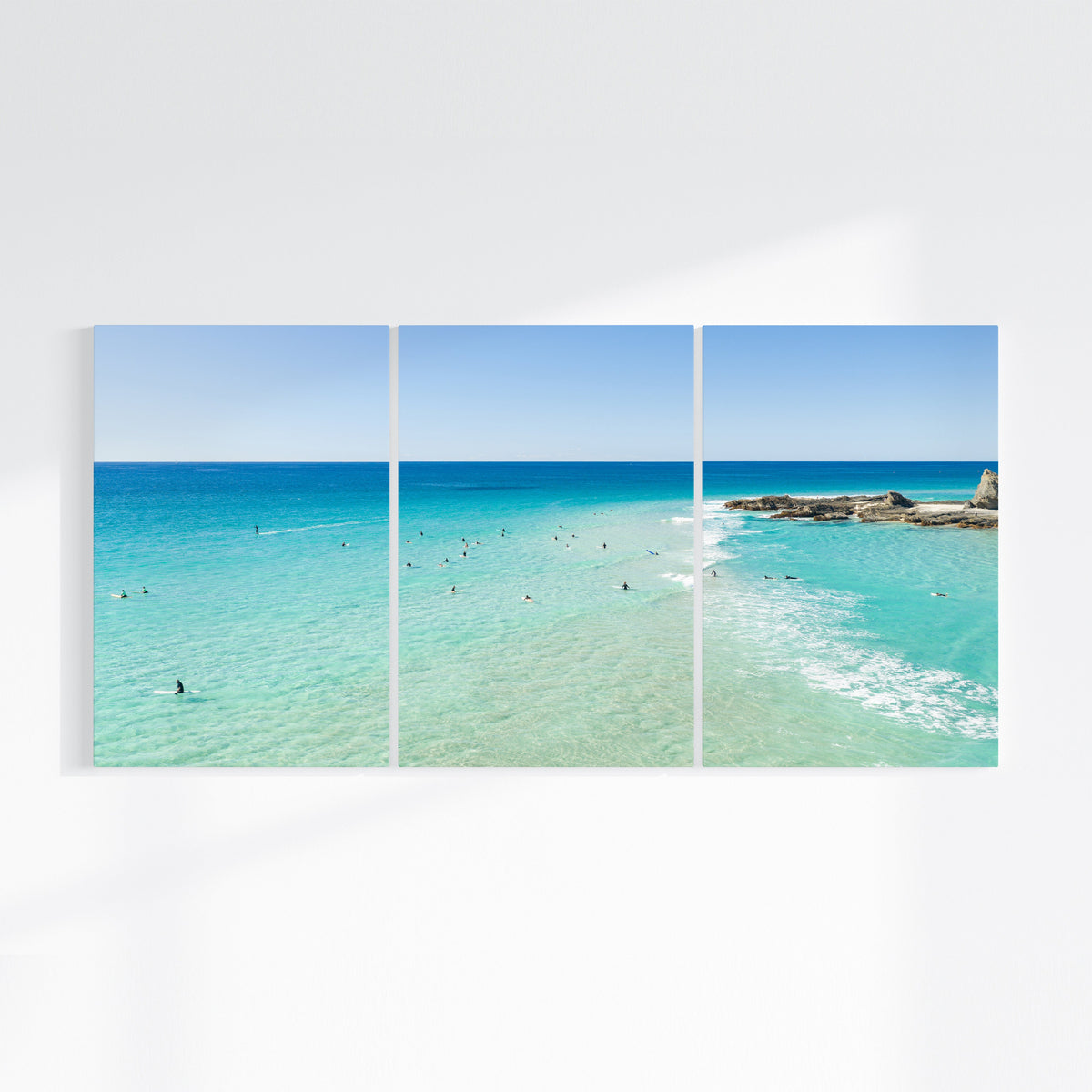 Palm Beach Surfers three piece canvas wall art II on wall