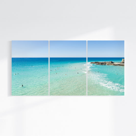 Palm Beach Surfers three piece canvas wall art II on wall